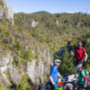 Ride through rich native bush and past towering volcanic cliffs on this epic cycle trail.