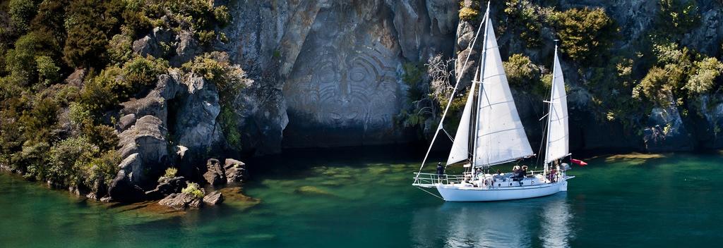 Viewing the Mine Bay Maori Rock Carvings by sailboat