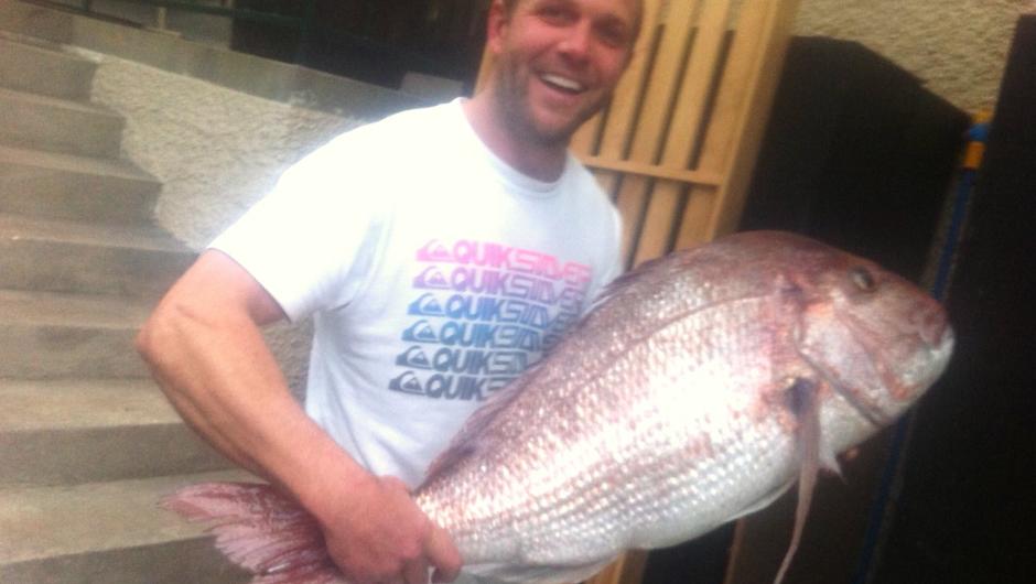 Happy angler with a large snapper