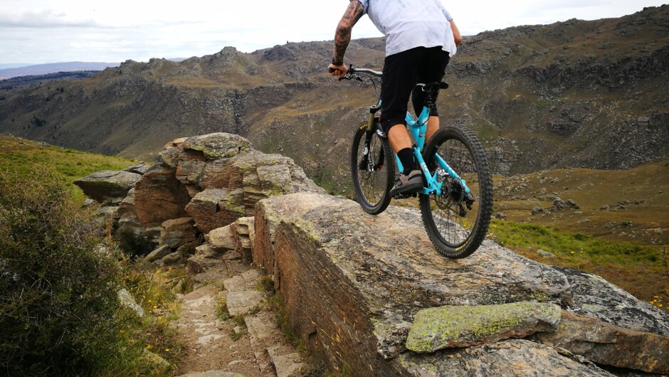 Alex riding, rocks and awesome terrain