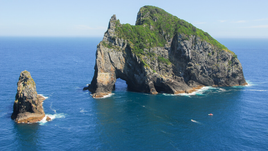 Helicopter over the Hole the Rock or take a cruise