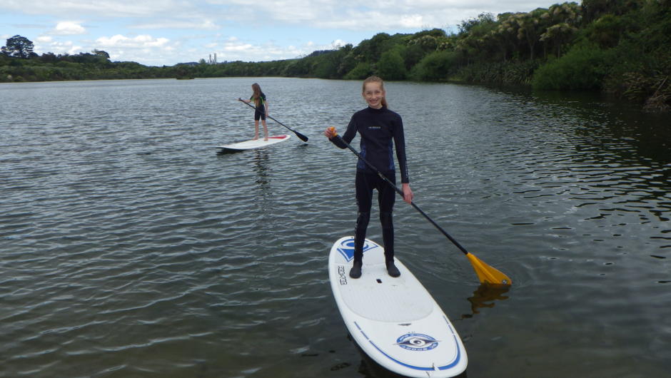 Young ones learning to SUP board