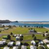 Aerial view of Mangawhai Heads Holiday Park and beach
