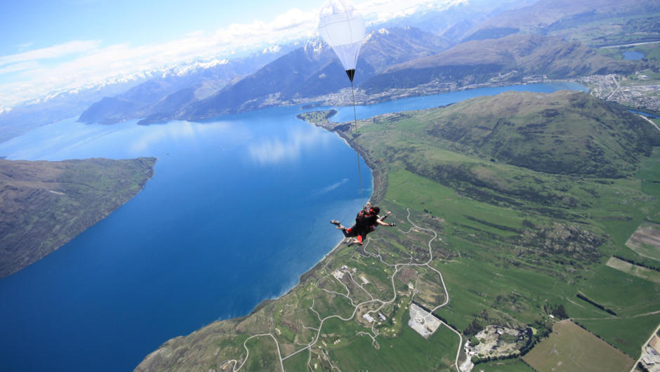 Skydive high above Queenstown alpine resort, over crystal clear lakes and snow-capped mountains.