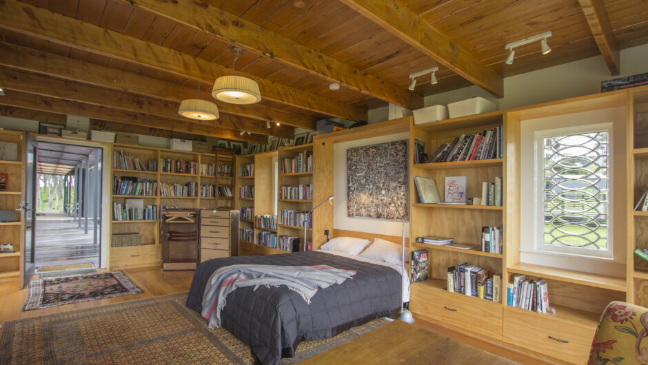 Library - Plenty of reading material in this double bedroom with wood-fire