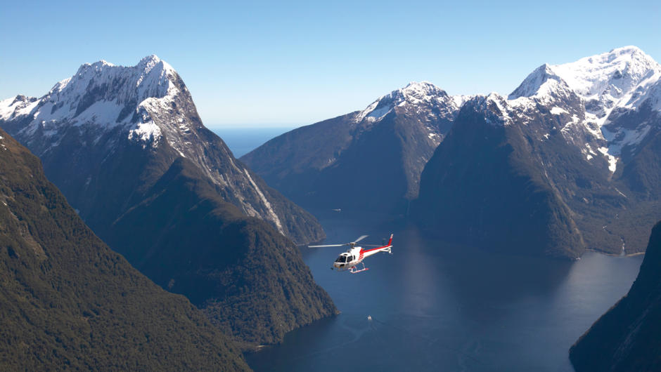 Experience an exhilarating flight past spectacular mountains and blue-green ice falls to Milford Sound.