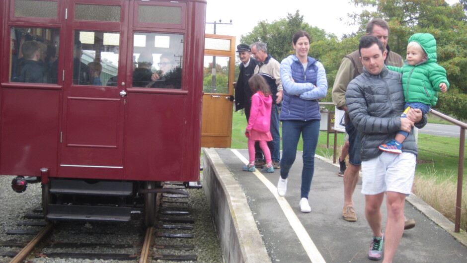 Family alighting the Model T Railcar