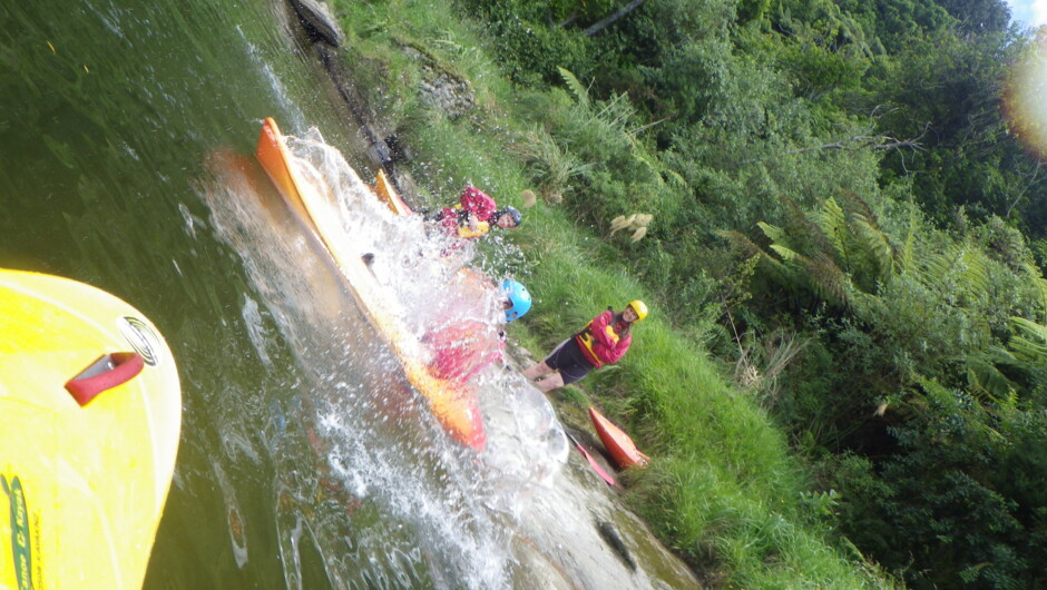 At the bottom of the kayak slide