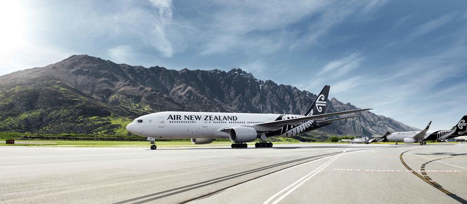 Air New Zealand plane at the beautiful Queenstown Airport, nestled in the mountains near Lake Wakatipu.