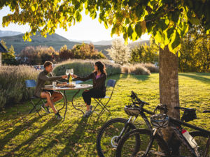 When you're biking the Queenstown Trail, enticing food and wine opportunities pop up at regular intervals. Pause for a while to enjoy a wine and a platter of delicious local produce.