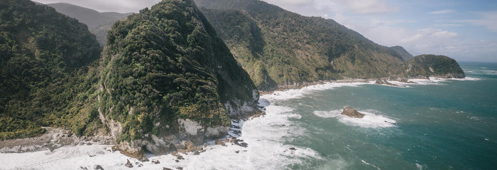 Aerial view of the coast off Hollyford Track in Southland, New Zealand