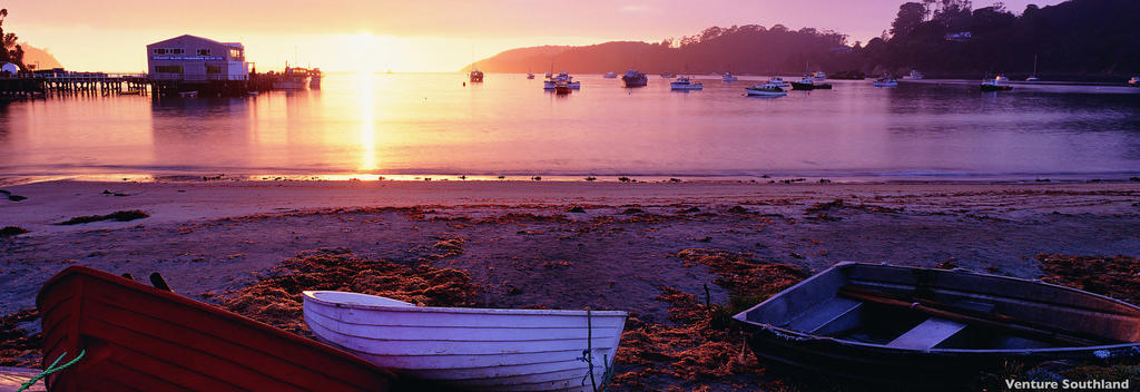 The quiet beach of Halfmoon Bay and watch the sun come up at one of New Zealand’s most s