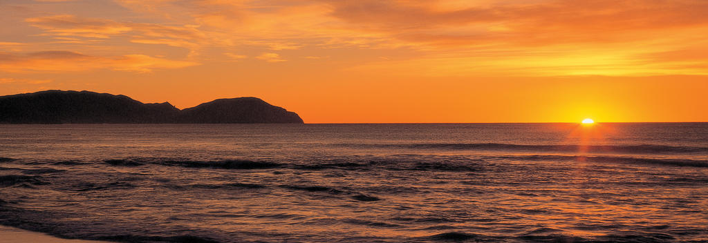 Feel revitalized after an eventful NYE by watching the sunrise at Wainui.