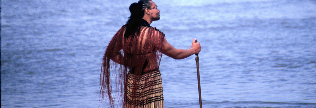 A Maori warrior surveys the oceans near Ngāmotu (New Plymouth). Māori oral history tells of vast ocean voyagers across the Pacific.