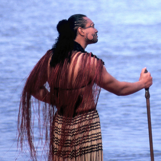 A Maori warrior surveys the oceans near Ngāmotu (New Plymouth). Māori oral history tells of vast ocean voyagers across the Pacific.