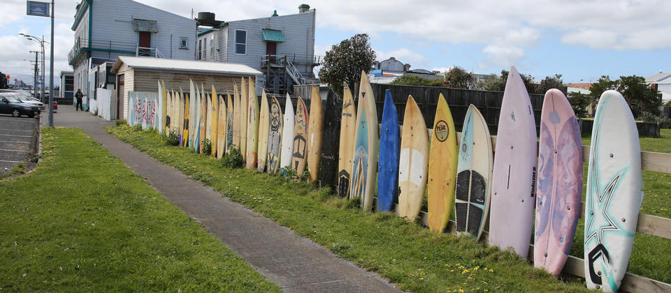 Famous Ōpunake surfboard fence