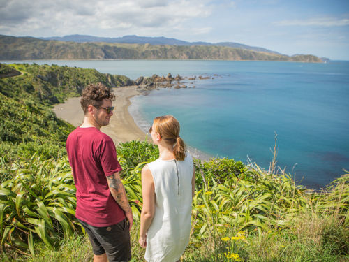 Couple walking on the Eastern Walkway, Breaker Bay, Wellington