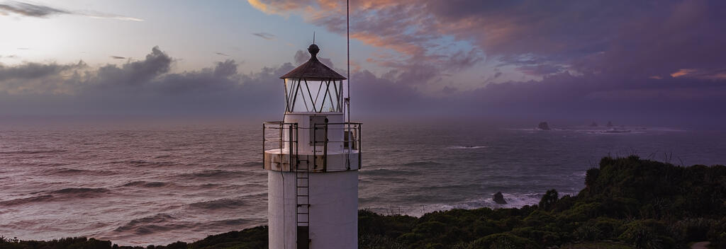 Aerial view of Cape Foulwind lighthouse at dawn