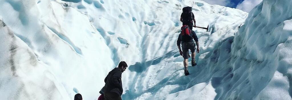 Hiking the stunning blue ice on Fox Glacier on the West Coast of New Zealand.