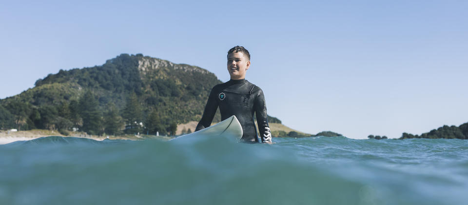 Learn to surf along the Bay of Plenty coastline