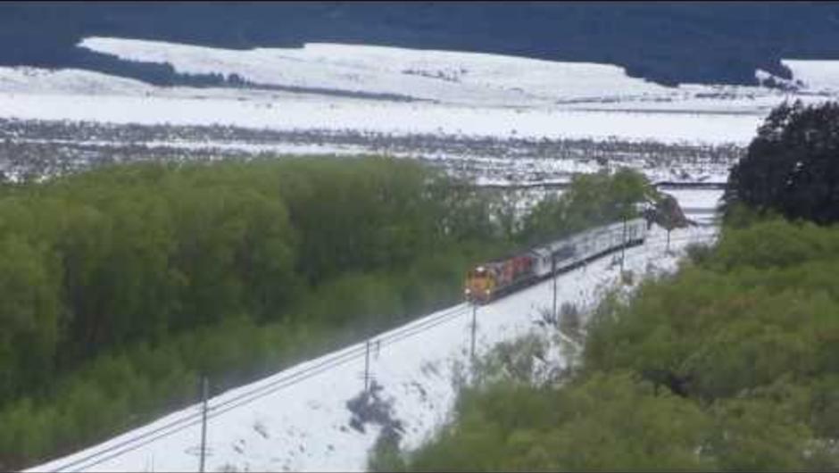Snow scenes as the Tranz Alpine Train runs alongside the Waimakariri River.