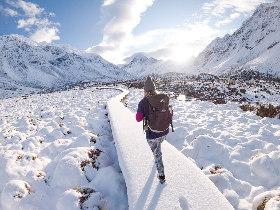 Woman snowshoeing in the Hooker Valley