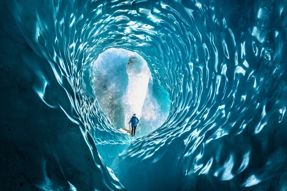Person exploring Tasman Glacier Ice Cave 