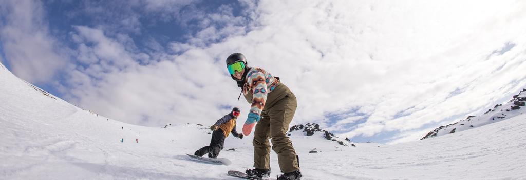 People snowboarding in Cardrona, New Zealand