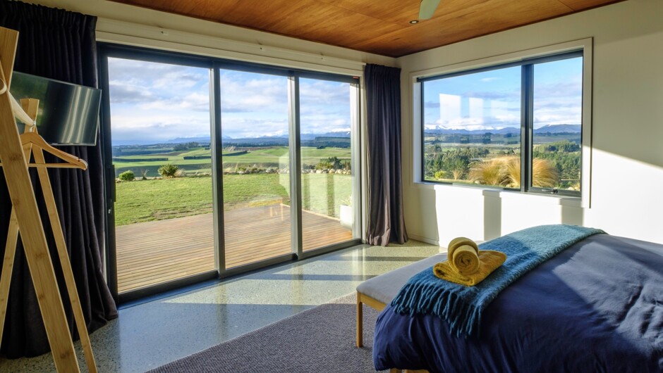 The master bedroom has a super-king sized bed with quality linen and pillows. Stunning panoramic views to the north and east allow glorious morning light to flood the Master bedroom when the black-out curtains/blinds are not in use. Ducted heating & air c