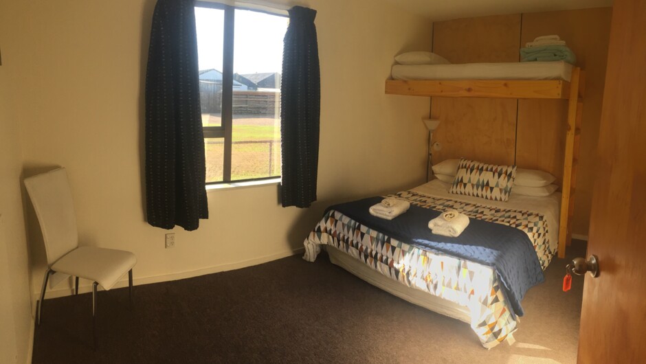 Family Room with En-suite. Queen Bed with overhead Bunk - toilet, basin and shower in the en-suite. Perfect room for families of 3, cosy and quiet.