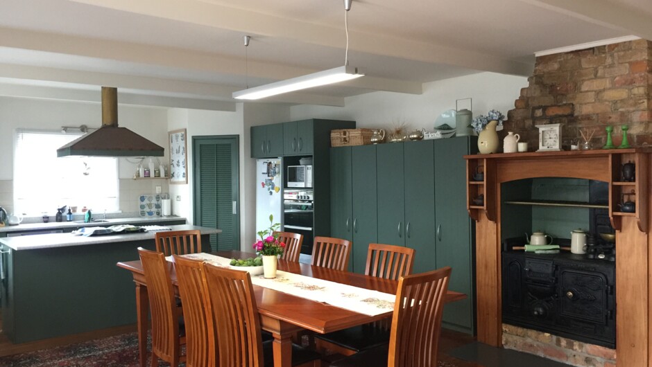 Guest dining area where a continental breakfast and filled croissant is enjoyed with a cup of tea, coffee and a chat.