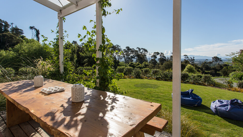 Family-friendly lawn and sunny verandah with fantastic views