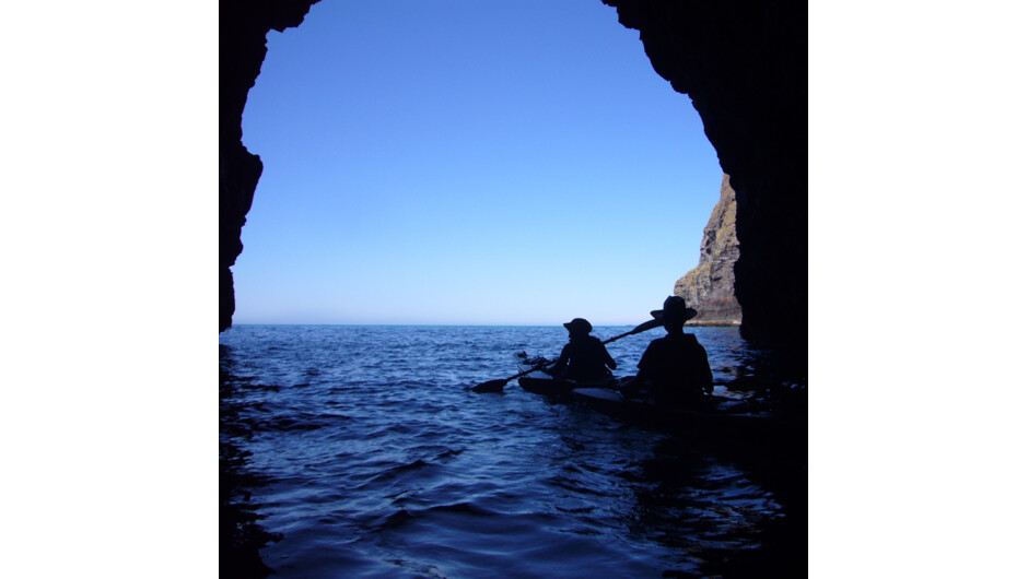Sea-kayaking through a sea-cave of Pohatu Marine Reserve