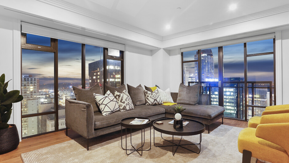 Modern styled living room with breathtaking views over Auckland city.