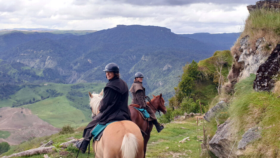 Trekking through New Zealand hill country with River Valley Stables.