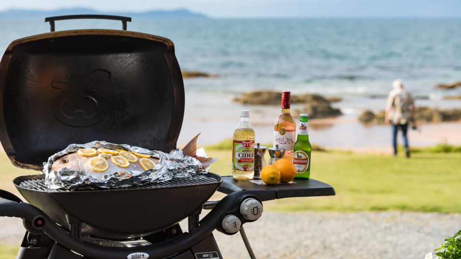 So close to the beach. Cook a fish on the Weber BBQ on the deck at Golden Sand Beachfront Accommodation on your beach holiday in Northland.