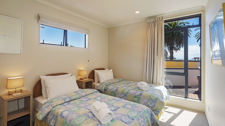 Bedroom 3 with single + single beds