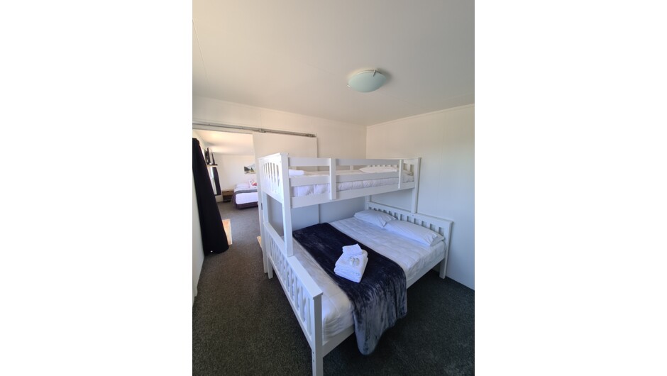 Our Self-contained units have all that one will need for wee holiday.  Featuring a bed in the lounge, TV and table and chairs plus small kitchenette, a spare bed in the bedroom, and a bathroom.