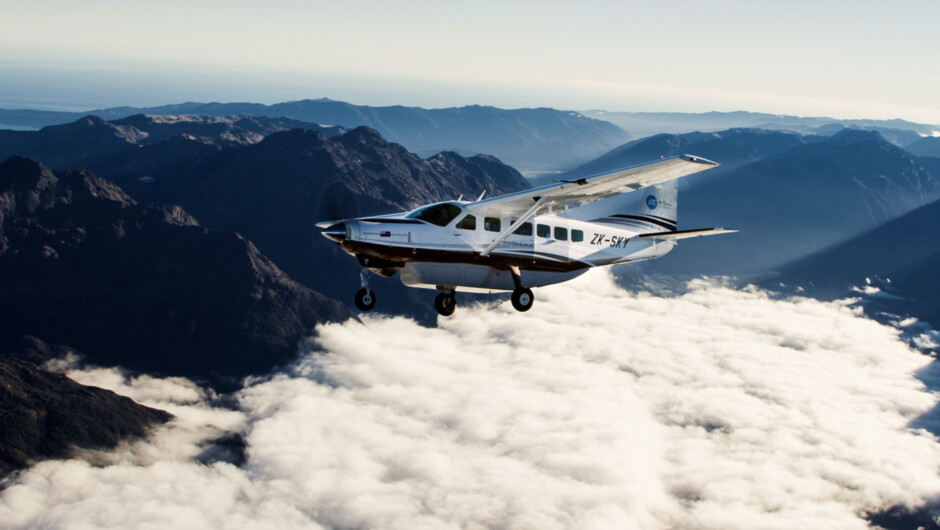 Flying above the clouds and through epic dramatic views that named Milford Sound one of the 7th wonders of the world.