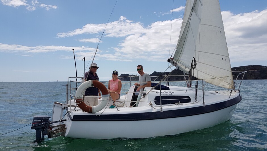 The instructor and students having a great time sailing down the channel aboard a Carnival, a Davidson 20