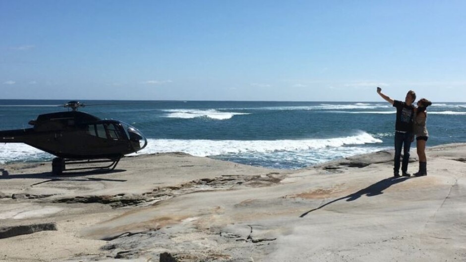 Set foot on a remote beach for a heli picnic.