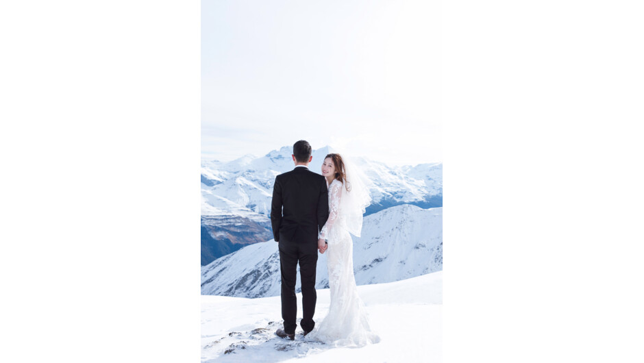 A snow landing heli pre-wedding photograph by photographer Panda Bay Films at Glenorchy