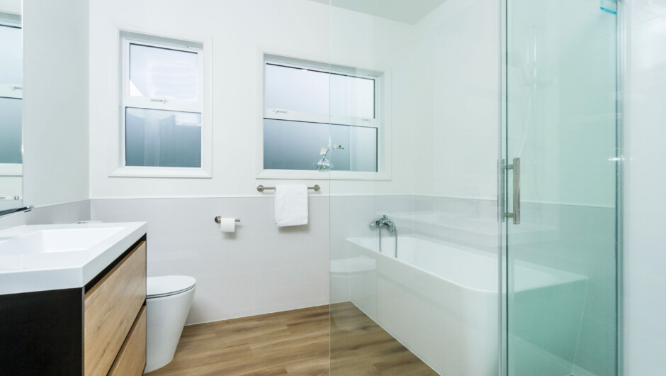 Main bathroom with walk-in shower, separate bath, toilet &amp; vanity