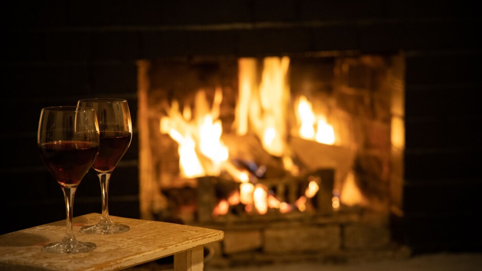 Snuggle up to the open fire. A heat pump is also in The Cottage.