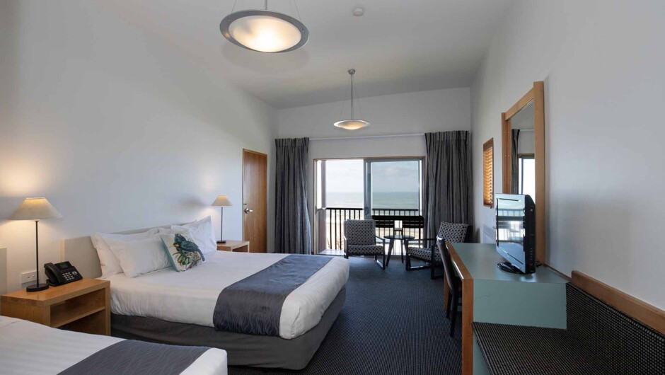 Grand Ocean View room (with balcony option), comes with a Queen and Single beds or twin queen beds, and en-suite bathroom.