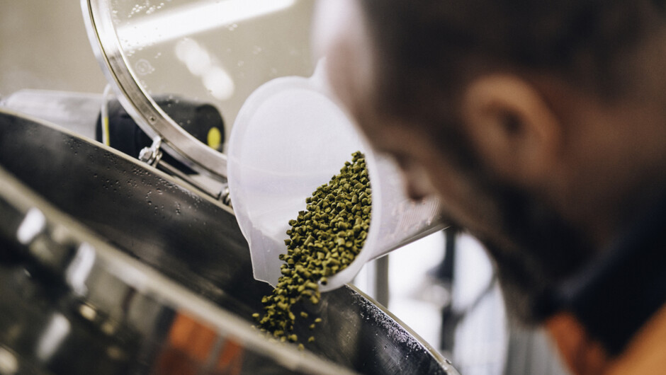 Jim pouring hops