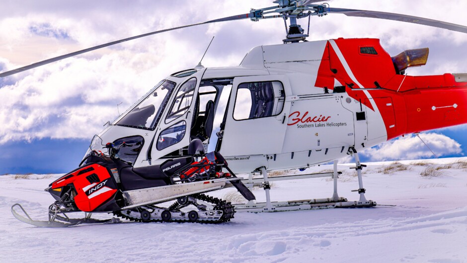 Enjoy a 15 minute scenic flight to and from our epic snowmobiles base.