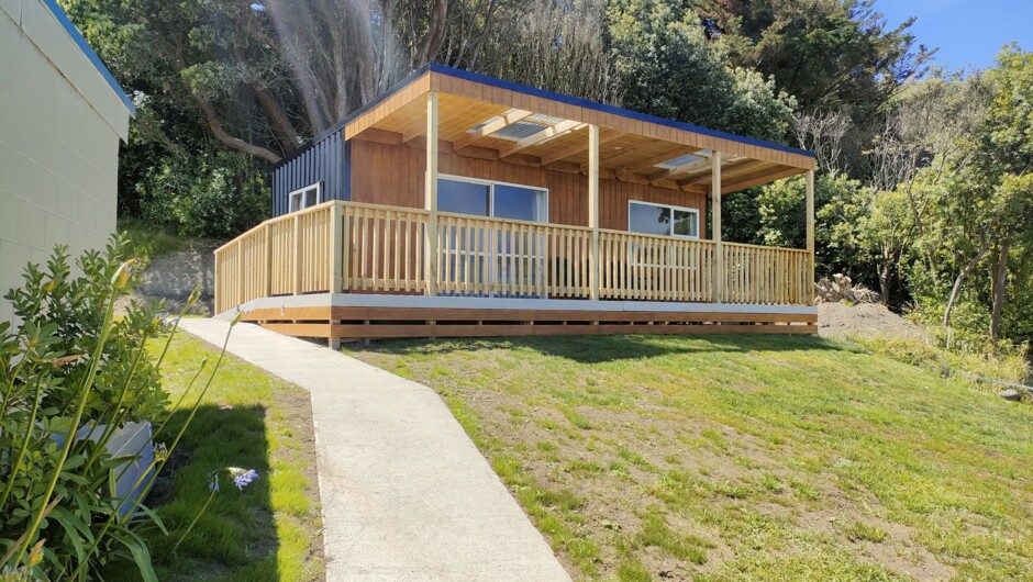 Sunset (sleeps up to 5) situated behind the toilet, shower, kitchen blocks.