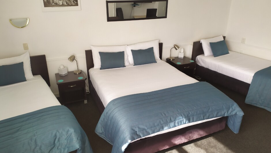 Large Queen Studio - One queen bed and two single beds. Ensuite bathroom with free toiletries, free WIFI, flat screen TV, tea and coffee making facilities, refrigerator, toaster, air fryer, and microwave. Heating and electric blankets.