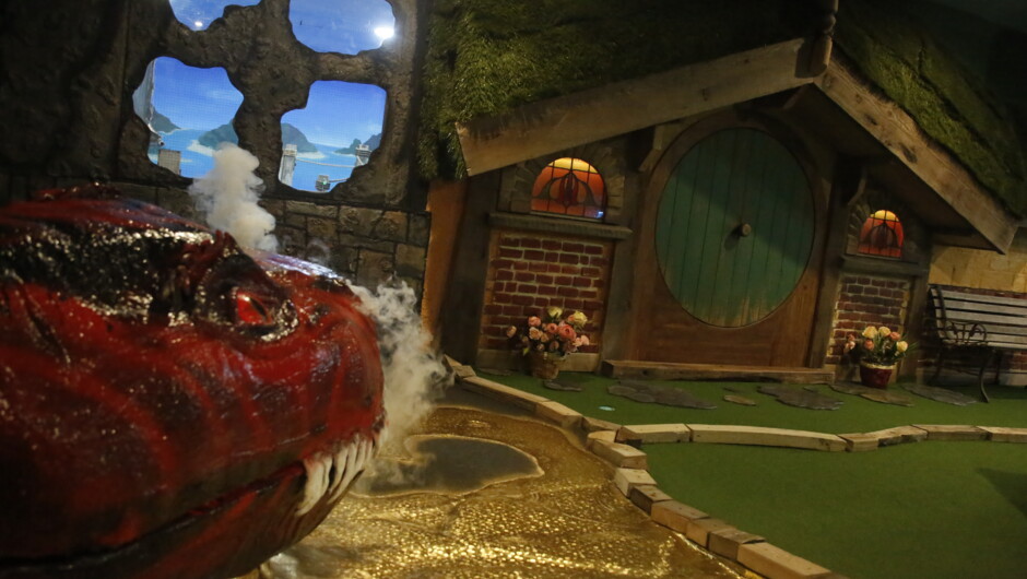Our fiery friend watches over Tiny Land in the 2nd of 3 epic, themed rooms.
